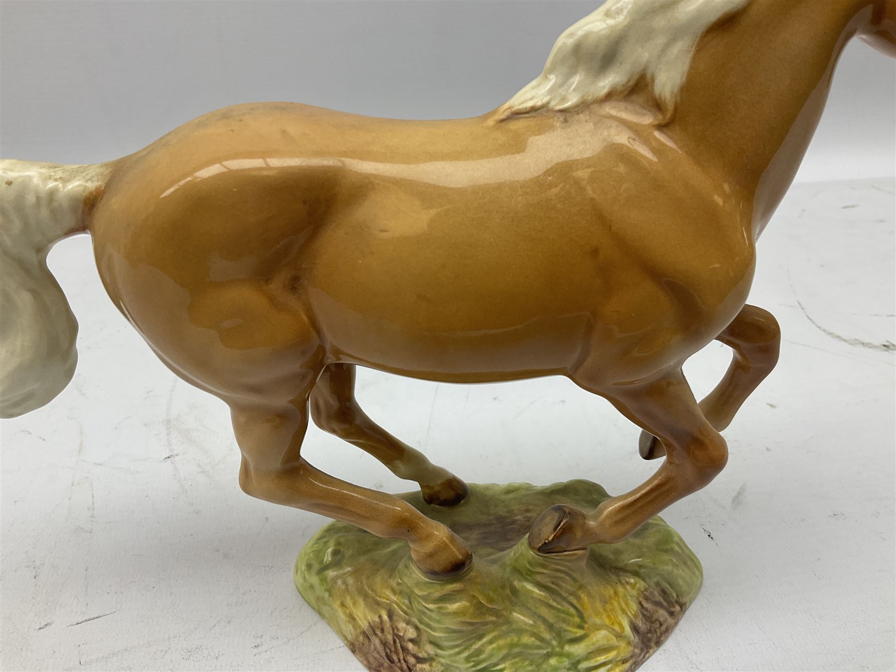 Beswick figure of cantering Palomino horse on base model no 1374, with impressed and printed mark beneath, H18cm