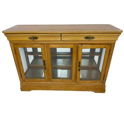 Yew wood sideboard, rectangular top with mahogany and ebony stringing, fitted with two drawers over three glazed cupboard doors enclosing glass shelves