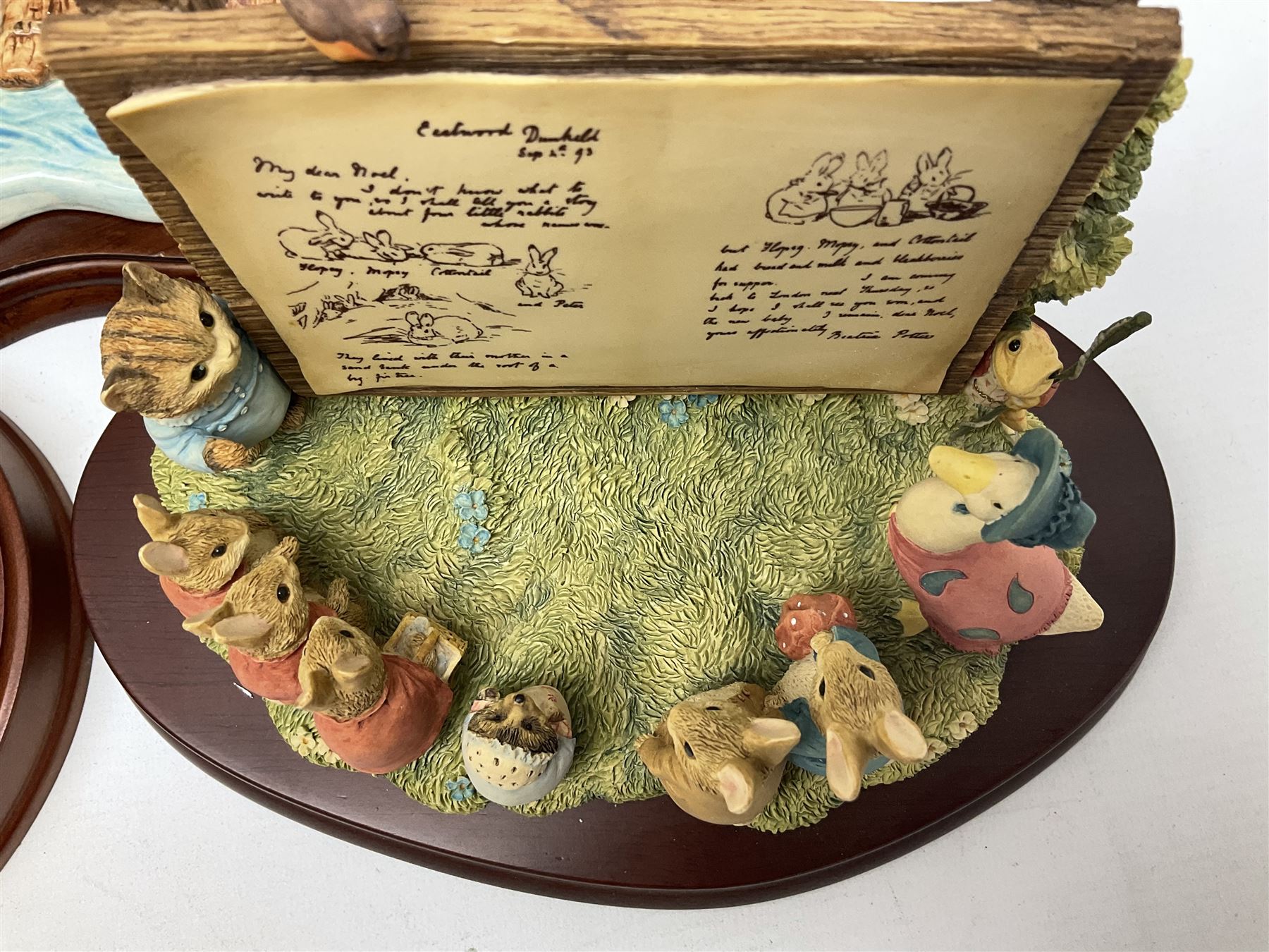 Four Border Fine Arts Beatrix Potter figures, comprising Tableau created to commemorate the Millenium together with a Border Fine Arts Limited Edition no 669814, The Tale of Peter Rabbit Tablet A1306, Four Little Rabbits A2442 and Sailing Home A2443