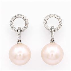 Pair of 18ct white gold pearl and diamond pedant earrings, each stud set with a halo of ro...