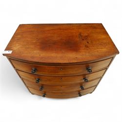 Mid-19th century mahogany bow front chest, fitted with four graduating drawers, turned ebonised handles, bun feet