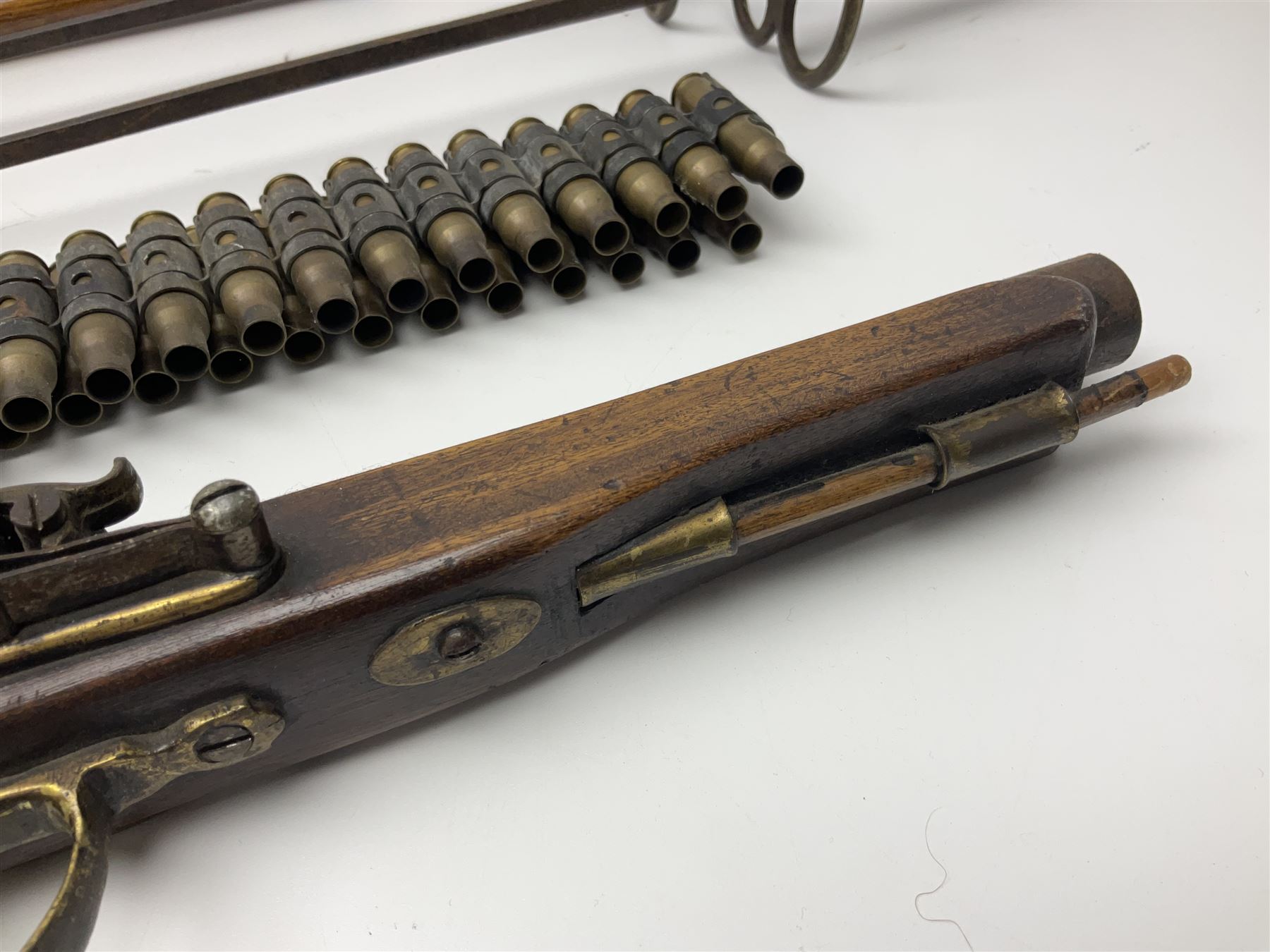 Leather covered swagger/sword stick with 40cm steel blade L62cm overall; another ash sword stick with 30cm diamond section steel blade; pair of fencing foils, the blades marked Solingen; two reproduction flintlock pistols; and 92cm inert cartridge belt (7)