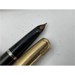 Three parker fountain pens, one example with 14ct gold plated cap and personal engraving, in Parker 51 box, together with a silver Sampson Mordan Everpoint propelling pencil with personal engraving and a silver cased fountain pen with 14ct gold nib and a souvenir bronze Dollfus-Mieg medallion, awarded to John G Sedorski, in fitted case 