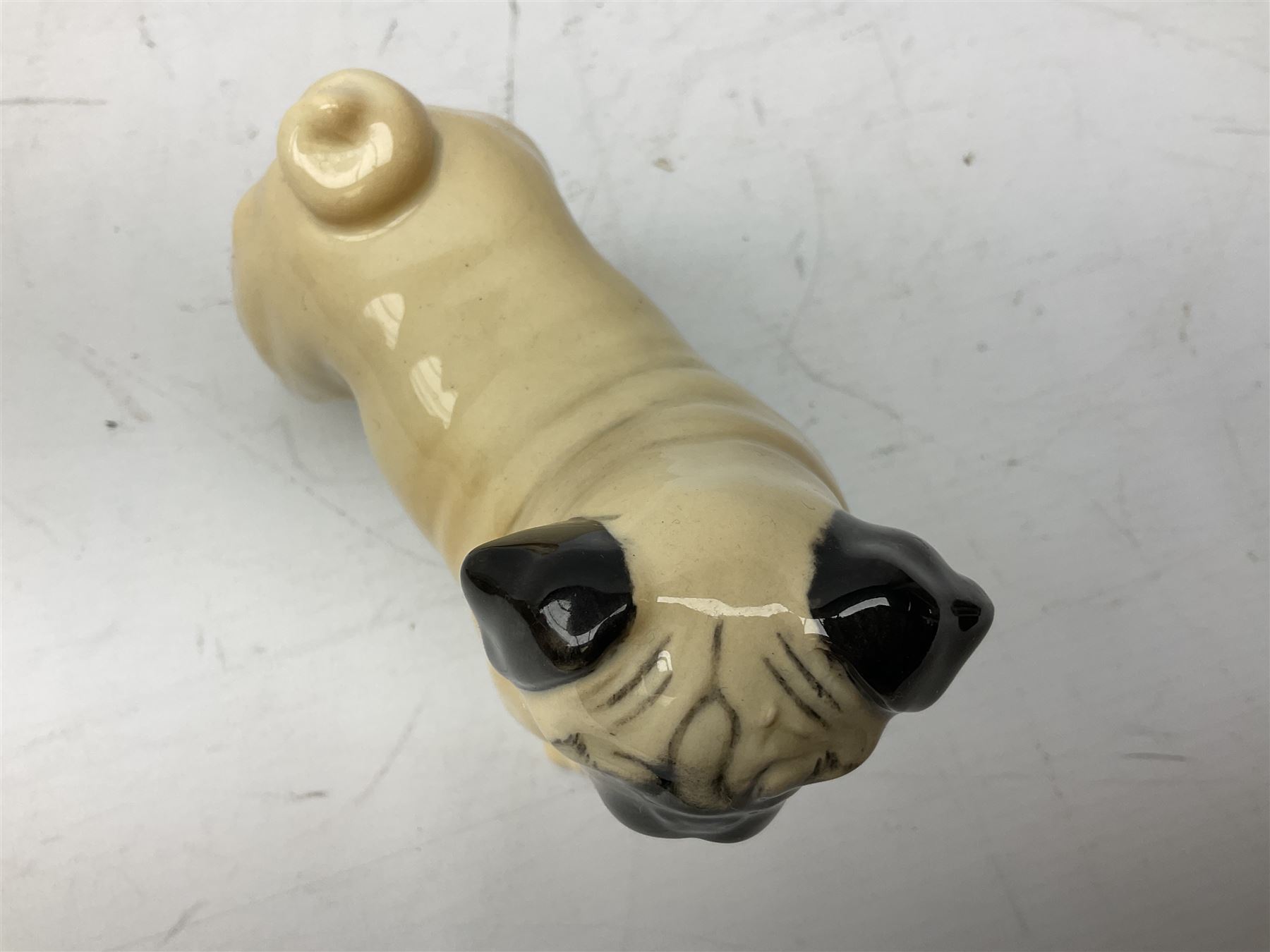 Three Beswick models comprising Hereford Bull no 949, 'CH Cutmil Cupie' Pug, and bay Shire horse, all with printed marks beneath