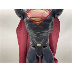 Composite Superman with cape, together with a composite female statue holding the American flag, tallest example H103cm