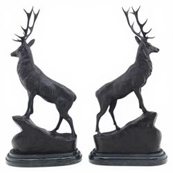 Pair of bronze stags, after Jules Moigniez, modelled in alert stance upon naturalistic bases, set on oval marble plinths, signed to base