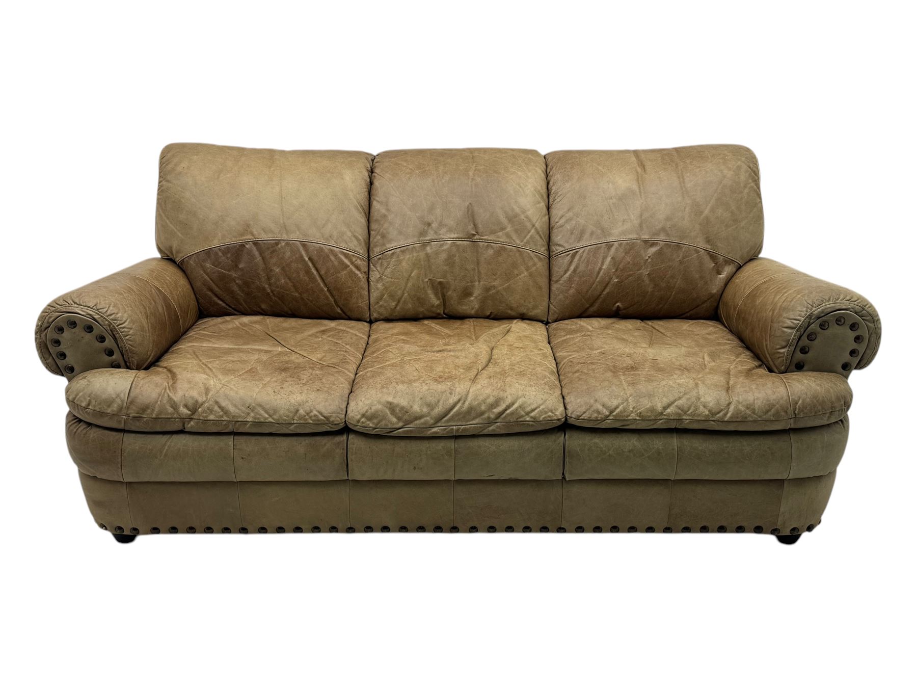 Contemporary three-seat sofa, upholstered in stitched brown leather with brass studwork decoration, rolled back and arms, raised on turned supports