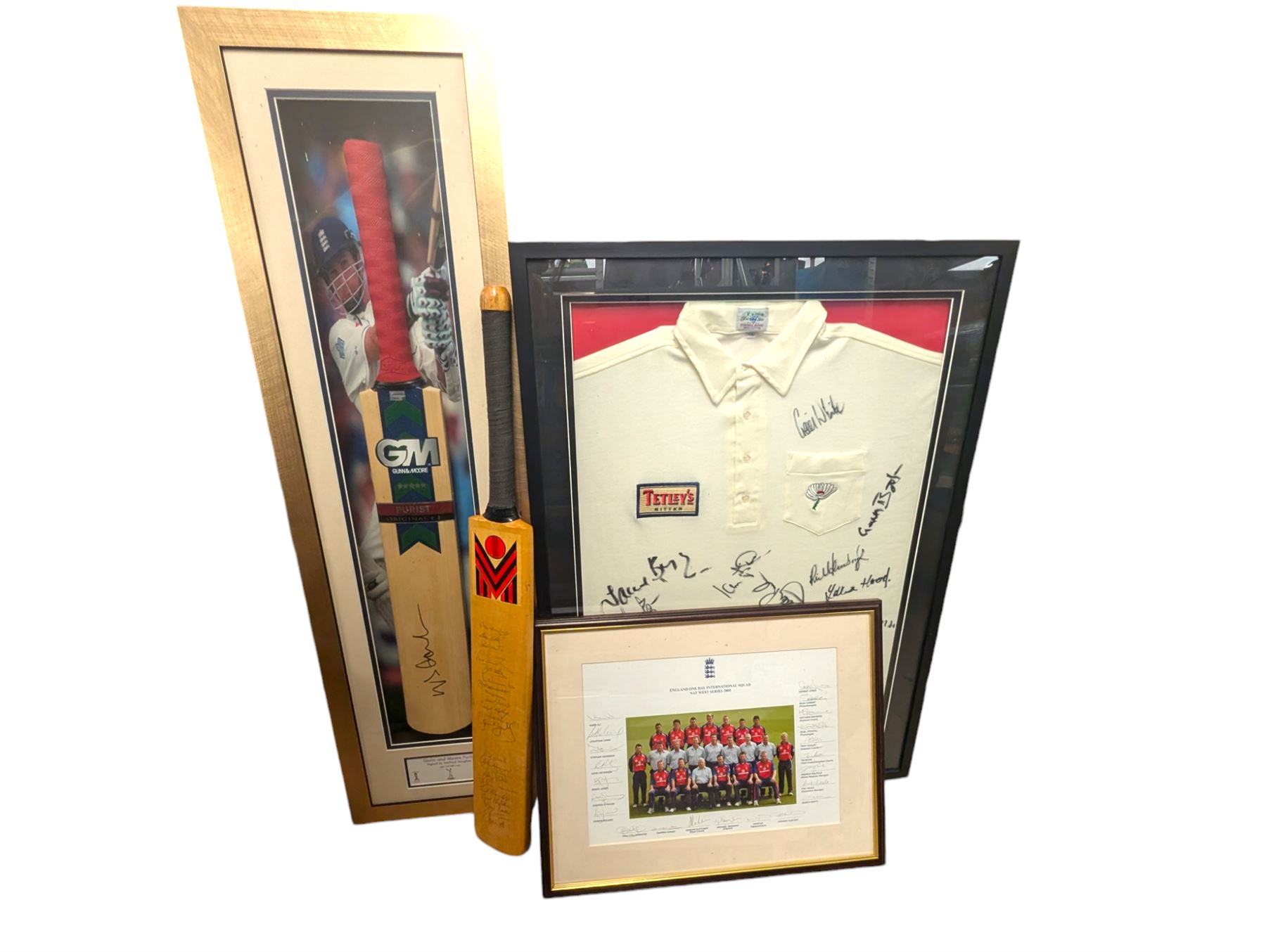 Signed England and Yorkshire cricket memorabilia, including framed bat signed by Michael Vaughn, signed photograph of England team, signed Yorkshire shirt and a signed bat