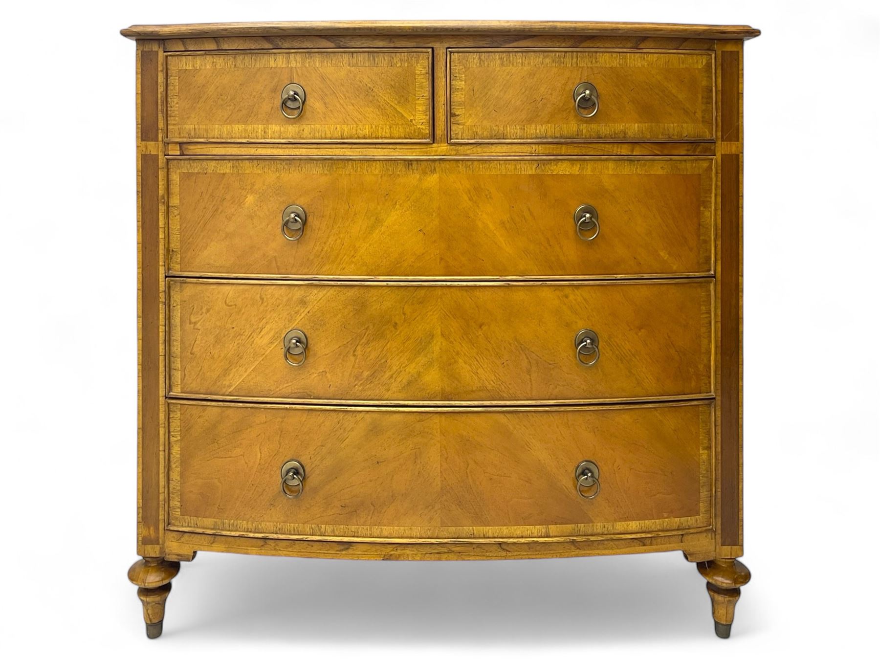 Frank Hudson - mid-20th century Mindi ash and burr walnut 'Spire' bow-fronted chest, featuring a crossbanded top over two short and three long cockbeaded drawers, raised on turned supports  