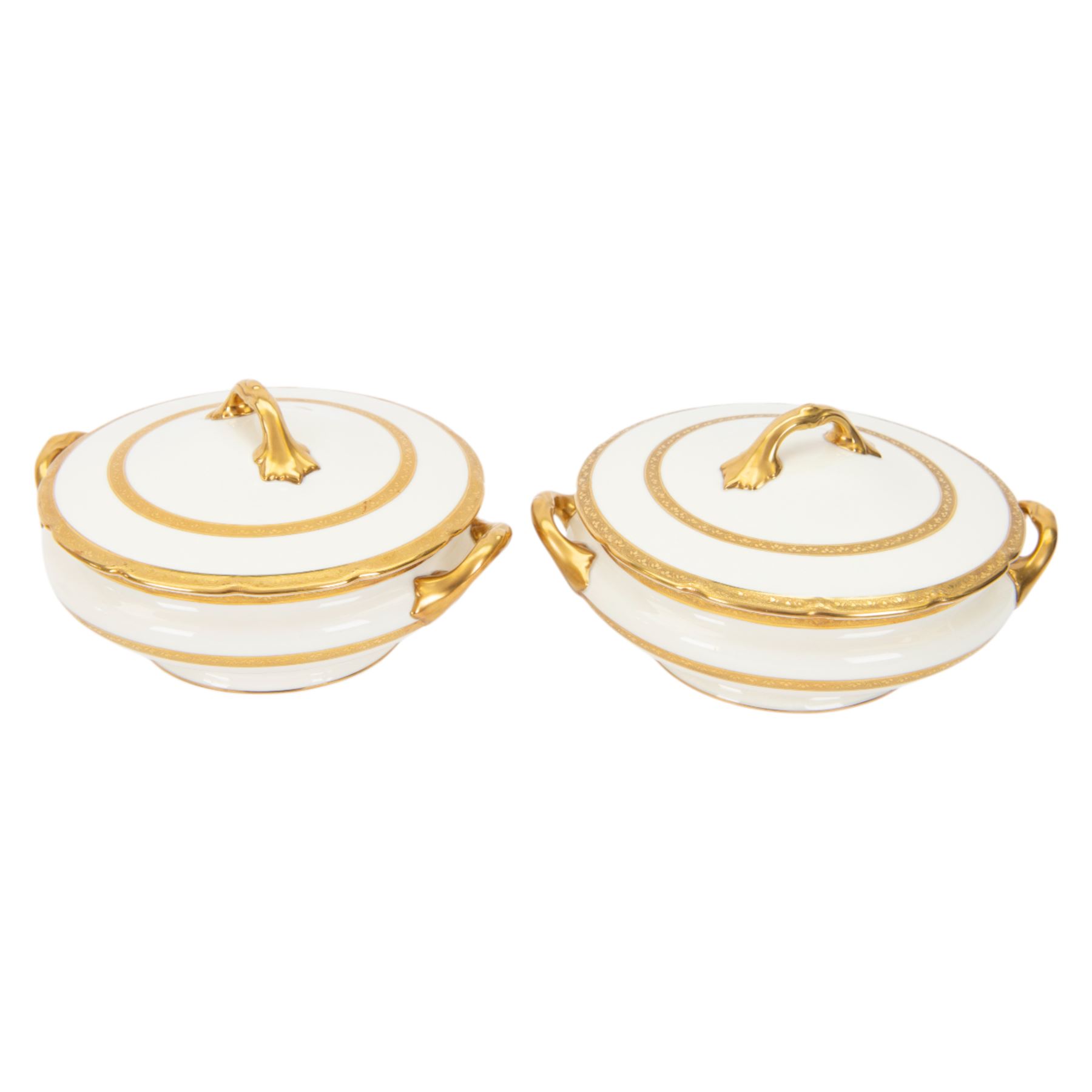 Royal Doulton 'The Balmoral' pattern dinner service for twelve place settings, comprising dinner plates, soup bowls and saucers, side plates, cake plates, three graduating meat platters, pair of tureens with covers and a pair of sauce boats with saucers, all with printed marks beneath