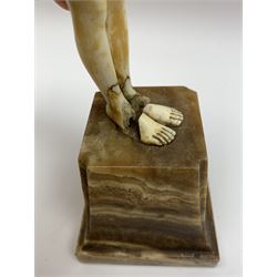 Demetre Chiparus (1886-1947): Innocence, a gilt bronze and ivory figure, circa 1925, standing in contemplative post with hands clasped, upon onyx plinth, signed to base, H24.4cm