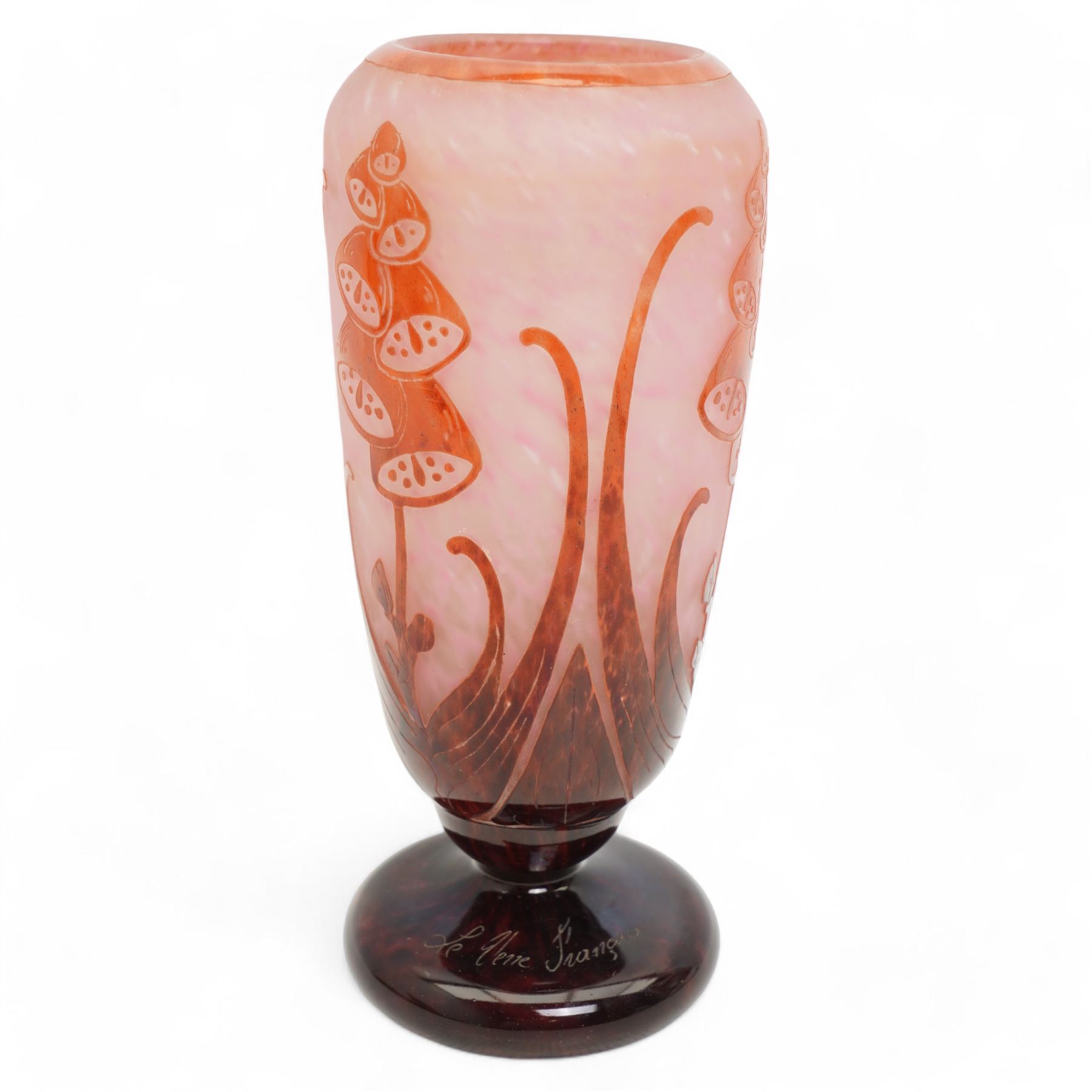 Le Verre Français, overlaid and etched cameo glass vase, circa 1920, internally mottled with pink and overlaid in amethyst with stylized floral decoration, the pedestal foot signed Le Verre Français, H26cm x D10.5cm 