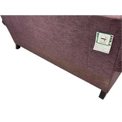 Parker Knoll - pair of large two-seat sofas upholstered in purple fabric, turned mahogany finish front feet with brass cups and castors 