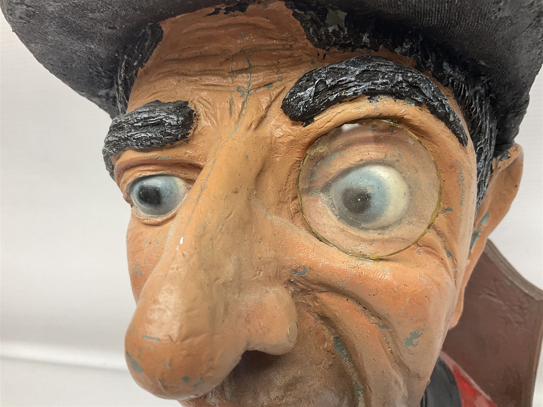 Composite figure of the head of a huntsman on a shield 'Caught by the Fox', D28cm