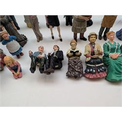 1:12 scale dolls house composite figures, including policeman, postman, maid, sitting and standing people in various styles of dress, etc