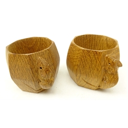  Pair of Robert Mouseman Thompson of Kilburn oak napkin rings each of octagonal barrel form with carved mouse motif, H5cm  
