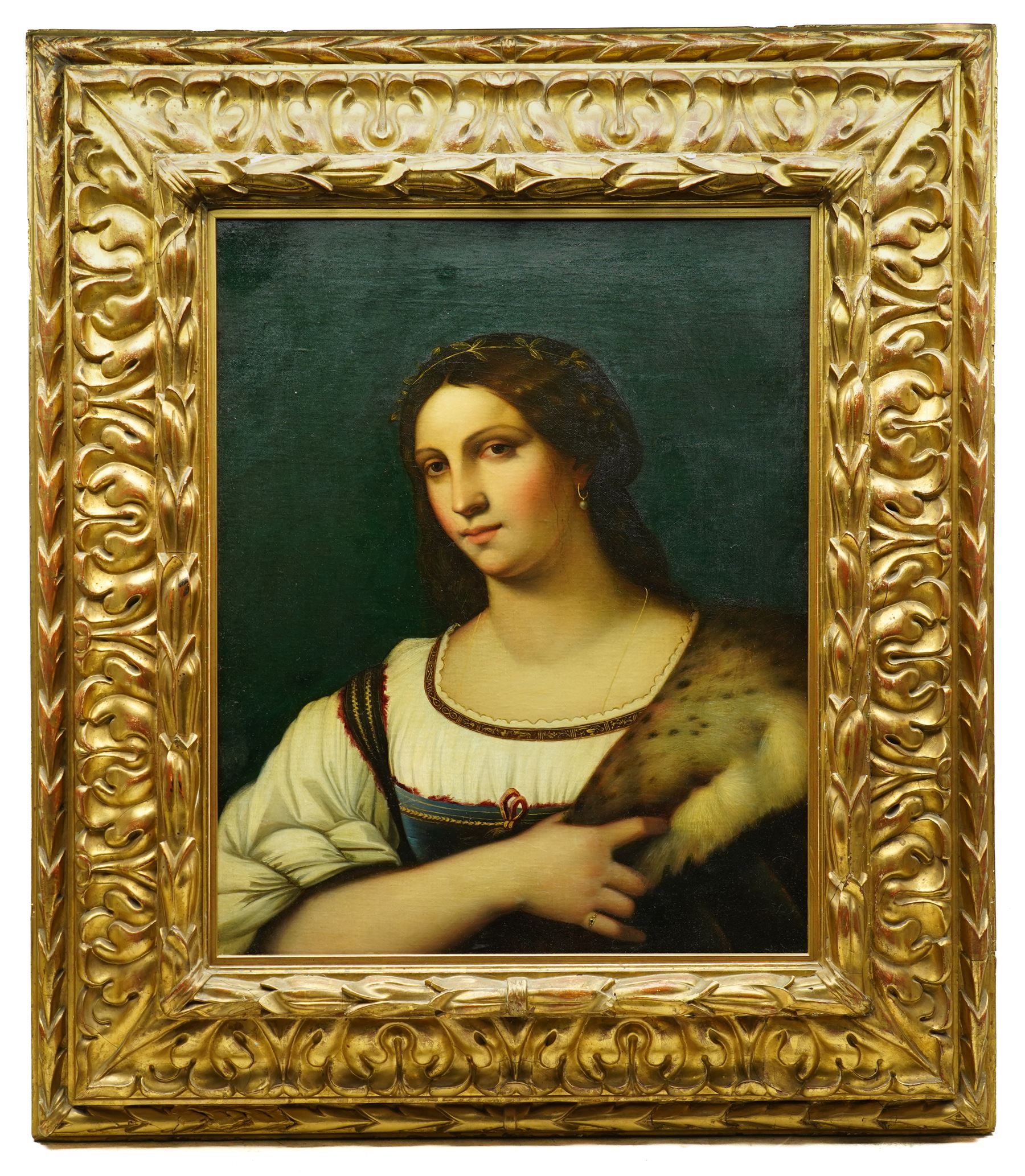 After Sebastiano del Piombo (Italian c.1485-1547): Half Length Portrait of a Lady in a Fur-trimmed Coat - 'La Fornarina', early 19th century oil on canvas unsigned 65cm x 52cm, housed in ornate giltwood and gesso frame with moulded acanthus leaves, overall 100cm x 87cm
Notes: the original, previously attributed to Raphael, is held in the Uffizi Gallery, Florence.