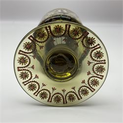 19th Century Bohemian amethyst glass lidded goblet, the bowl of faceted form, gilded with three children in period dress playing games, upon a knopped stem and conforming faceted foot, together with an art nouveau green glass goblet, with gilded rim, upon clear trumpet stem, and a hand blown wine glass, transfer printed with birds and three figures in period dress, tallest H29cm