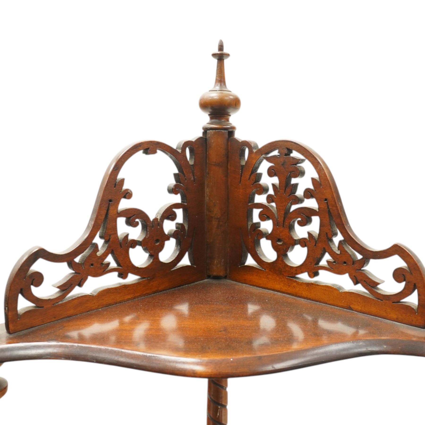 Victorian mahogany corner four-tier whatnot, shaped shelves with pierced and turned uprights, raised on turned supports
