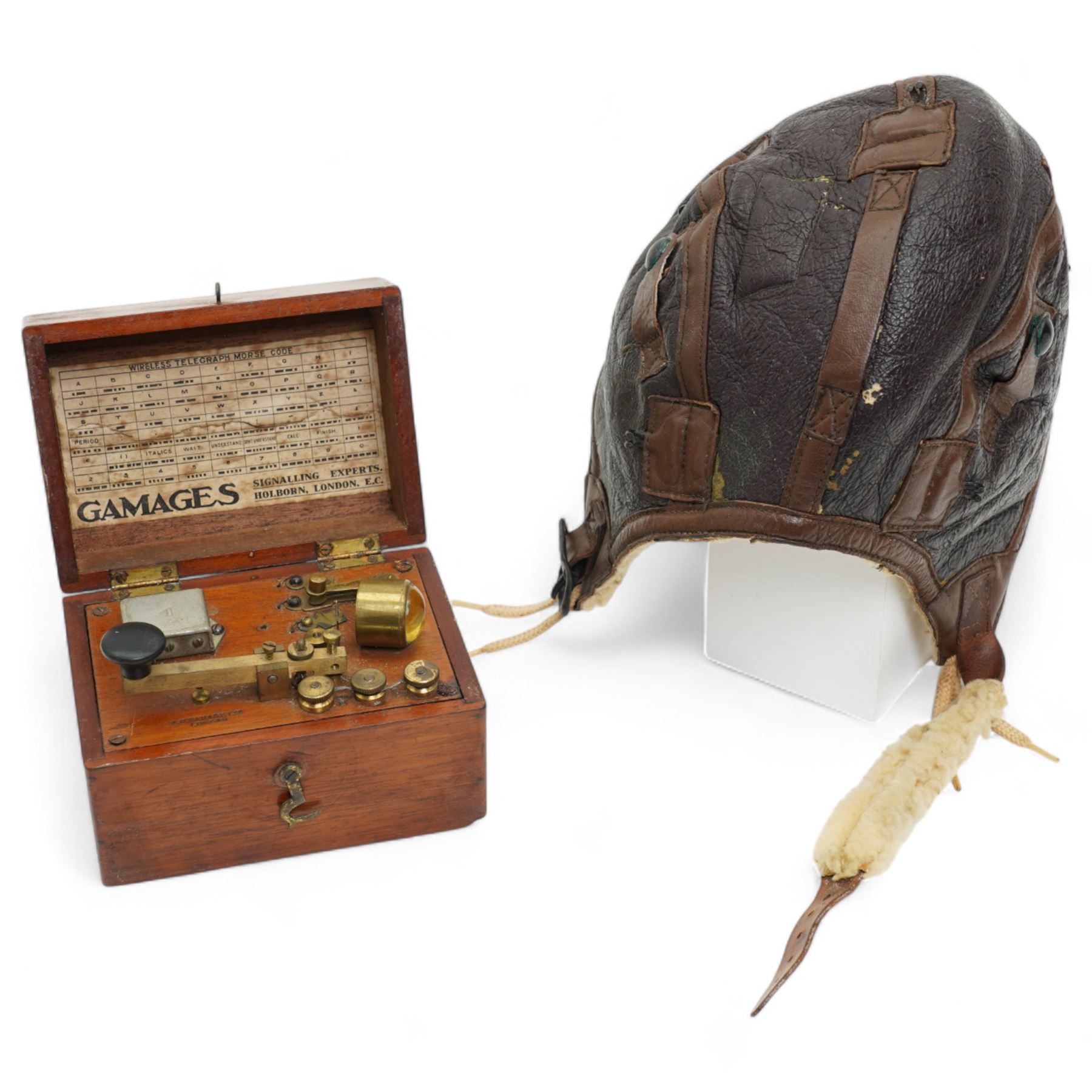World War II Type B-6 leather flying helmet, property Air Force U.S. Army and a Gamages morse code signaller in mahogany box (2)