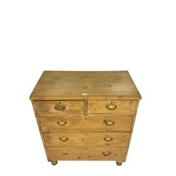 Victorian waxed pine chest, two short over three long drawers, turned feet