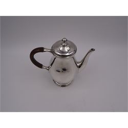 Liberty & Co 1930s small silver coffee pot, of plain baluster form, with brown Bakelite C handle with trefid mounts and cover with spherical knopped finial, upon circular stepped foot, hallmarked Liberty & Co, Birmingham 1934