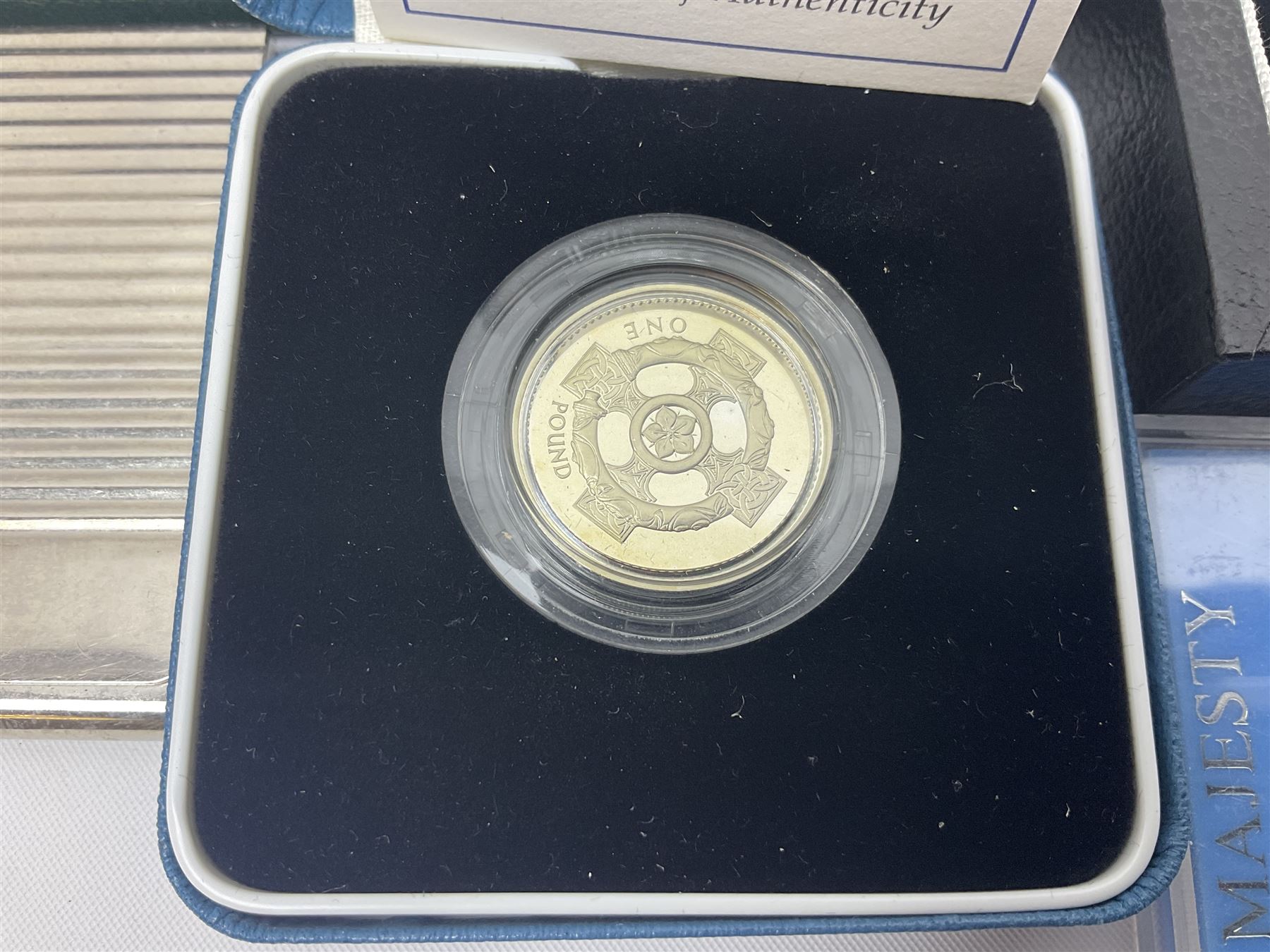 The Royal Mint United Kingdom 'Millennium' silver proof two coin set comprising 1999 and 2000 five pound coins, 2000 'The Queen Mother Centenary Year' silver proof crown, 2001silver proof one pound, 'Her Majesty The Queen Golden Jubilee 1952-2002' silver proof 2002 five pound coin and ten pound banknote set, all being cased with certificates, United Kingdom 1999 brilliant uncirculated coin collection in card folder, other commemorative coinage etc