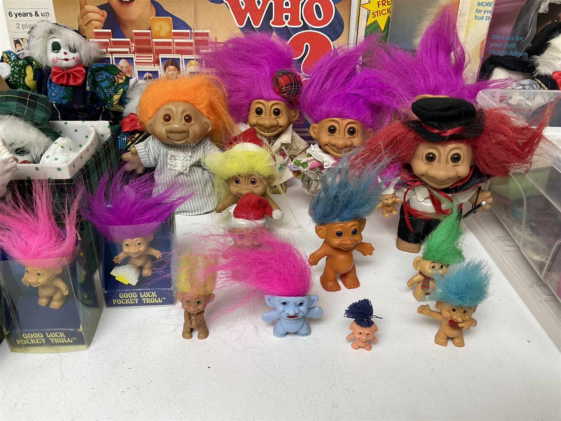 Collection of various toys to include Troll dolls, Guess Who, stuffed toy lion, Shark Chase, Shark Alert, Thomas and Friends Ready bed, and costume jewellery etc