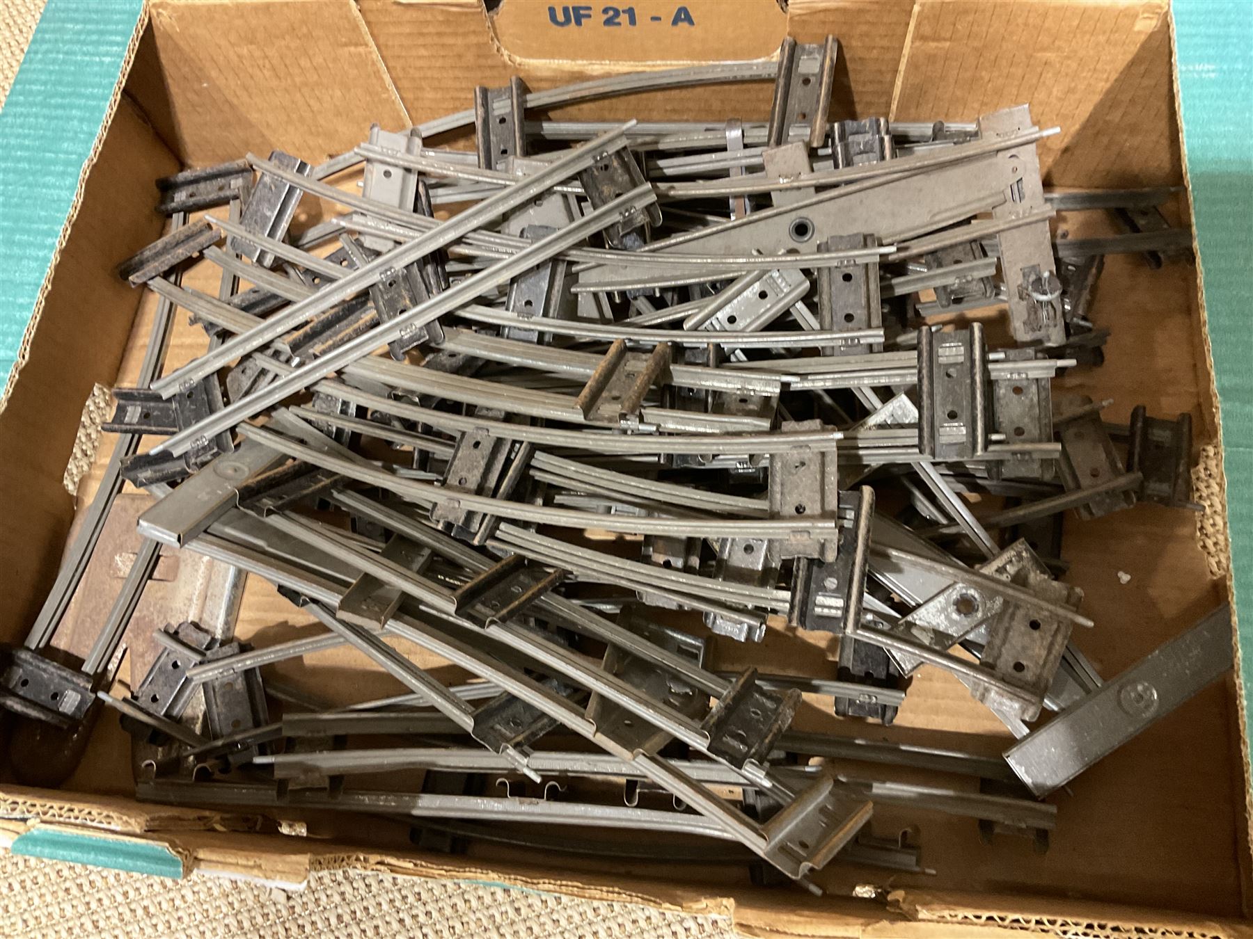 '0' gauge - large quantity of two-rail track with fixing clips including curves, straights, points, cross-overs etc; and boxed Meccano A3 Power Control Units; in four boxes