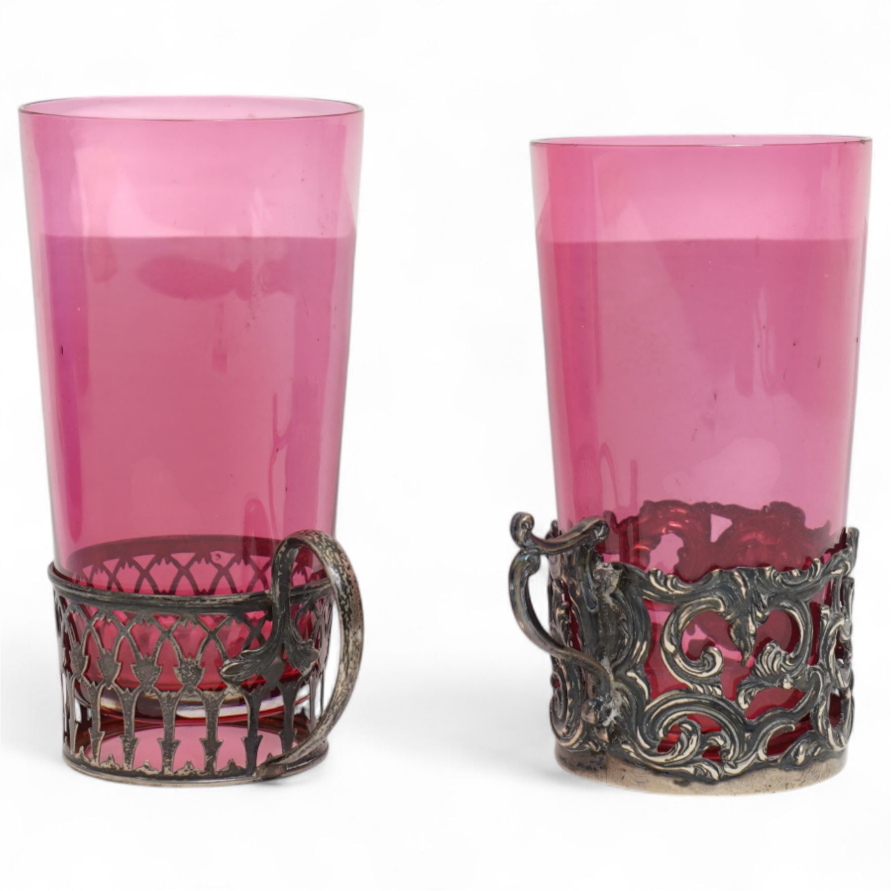 Late Victorian blue glass trumpet shape vase in pierced silver frame H20cm Birmingham 1899, modern blue glass globe scent flask with silver cover, two cranberry glass beakers in silver frames, cranberry sugar bowl in silver frame and blue glass sugar bowl with silver collar 
