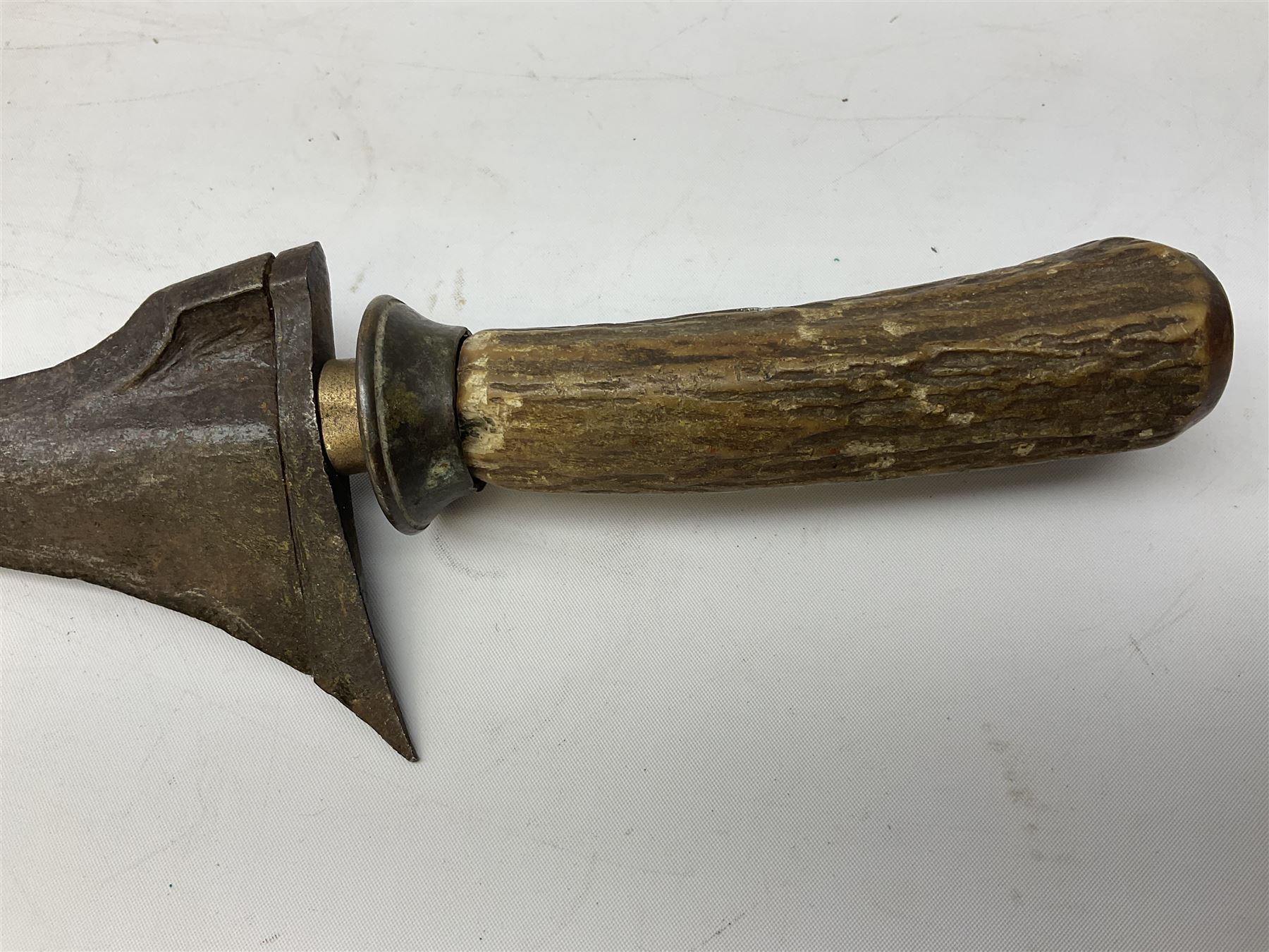 Malayan Kris dagger, the 31.5cm double edged straight heavy damascus blade with copper ferrule; carved hardwood grip; in large wooden throated scabbard with floral decorated white metal covering L47.5cm overall; a kris blade with adapted antler grip; and five various small daggers/letter openers (7)
