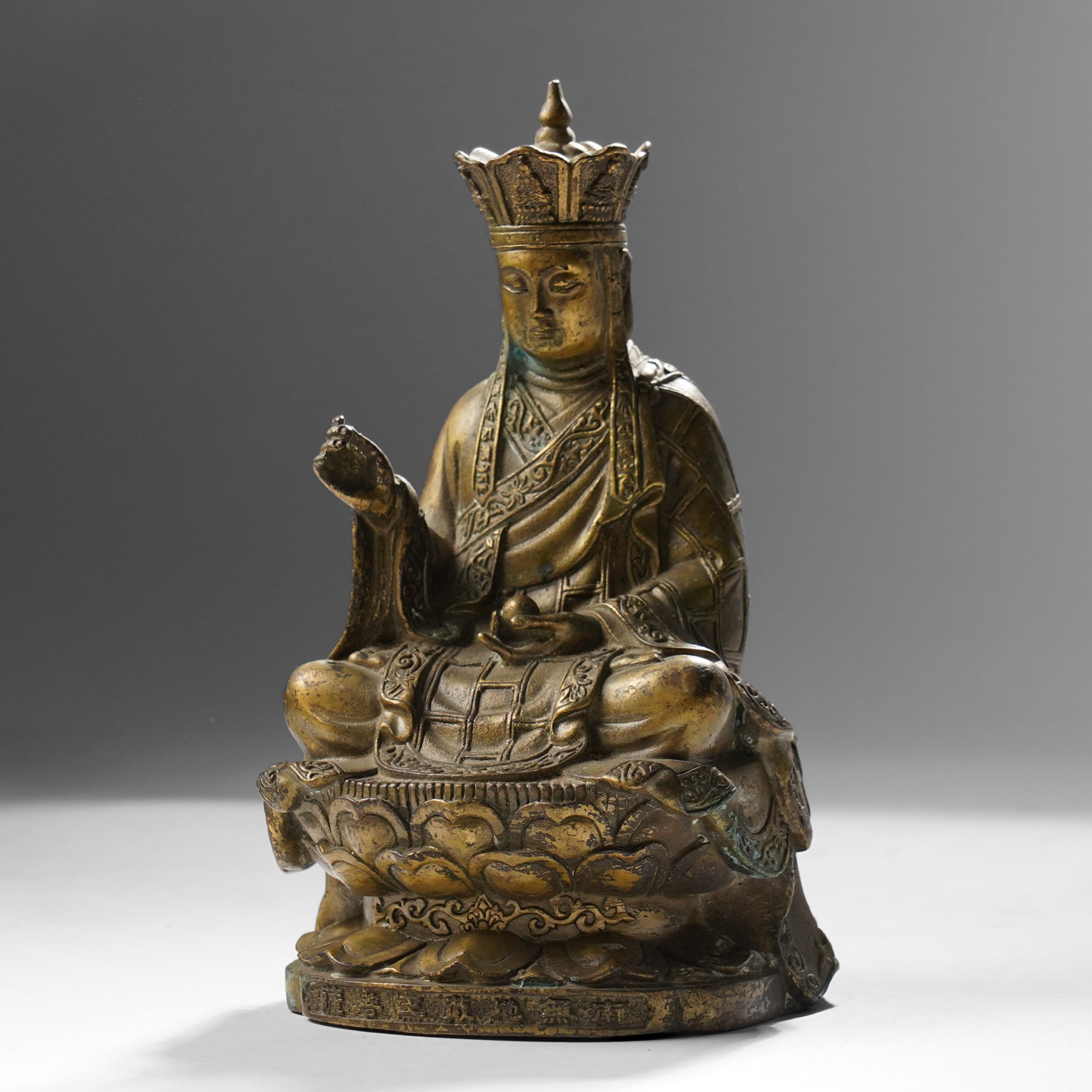 Chinese cast bronze figure of Ksitigarbha, wearing a five-pointed crown and monastic robes, H19.5cm