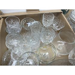 Large quantity of glassware, to include cut, coloured and moulded examples, drinking glasses, jugs, vases, bowls etc in five boxes