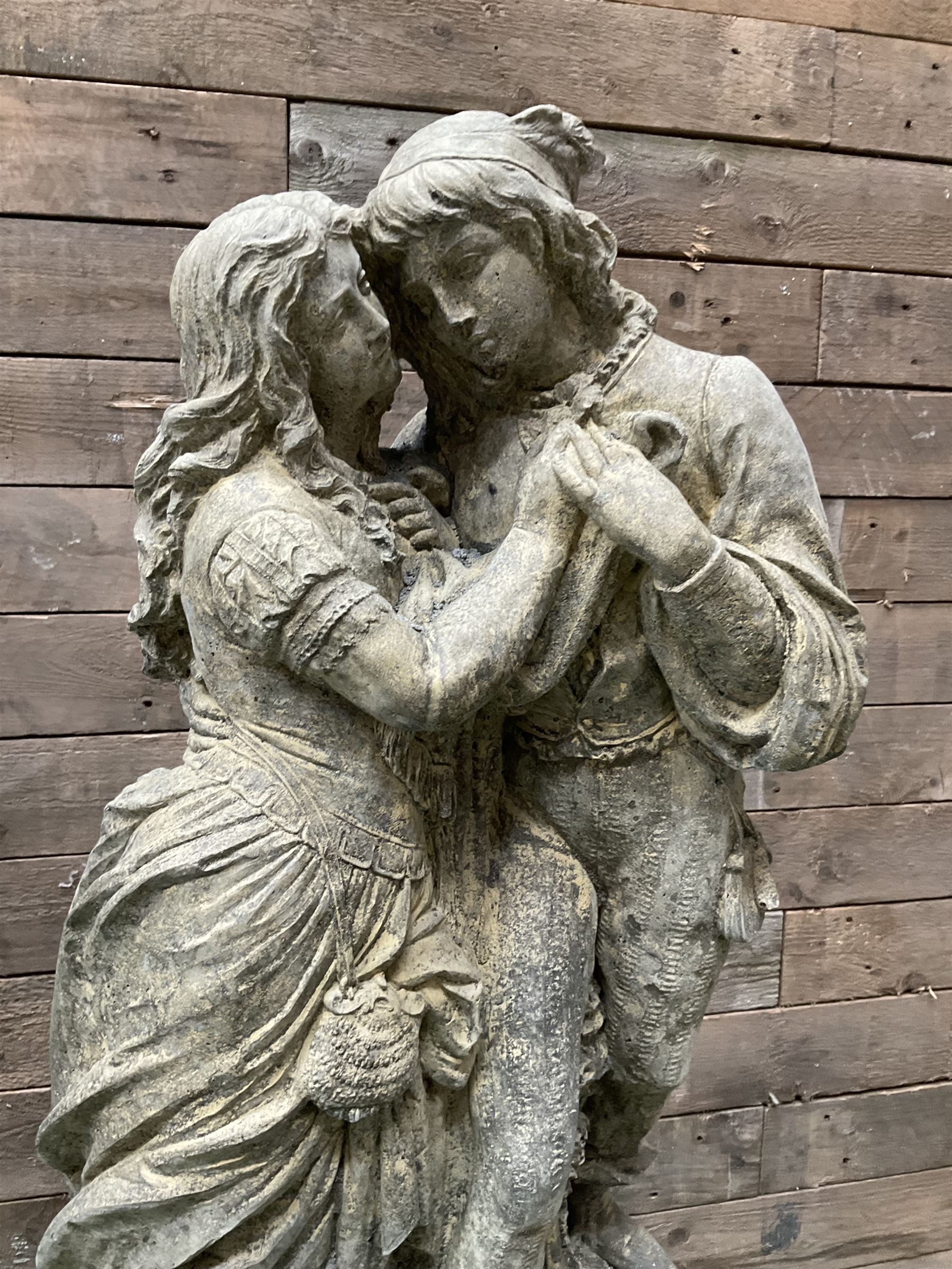 Romeo & Juliet - cast stone garden figure raised on circular fluted column - THIS LOT IS TO BE COLLECTED BY APPOINTMENT FROM DUGGLEBY STORAGE, GREAT HILL, EASTFIELD, SCARBOROUGH, YO11 3TX