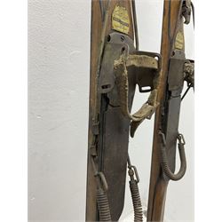 Pair of 1930s wooden skis, with painted metal runners beneath stamped Attenhofer, with retailers label for Ernst Gertsch Central Sports, L206cm