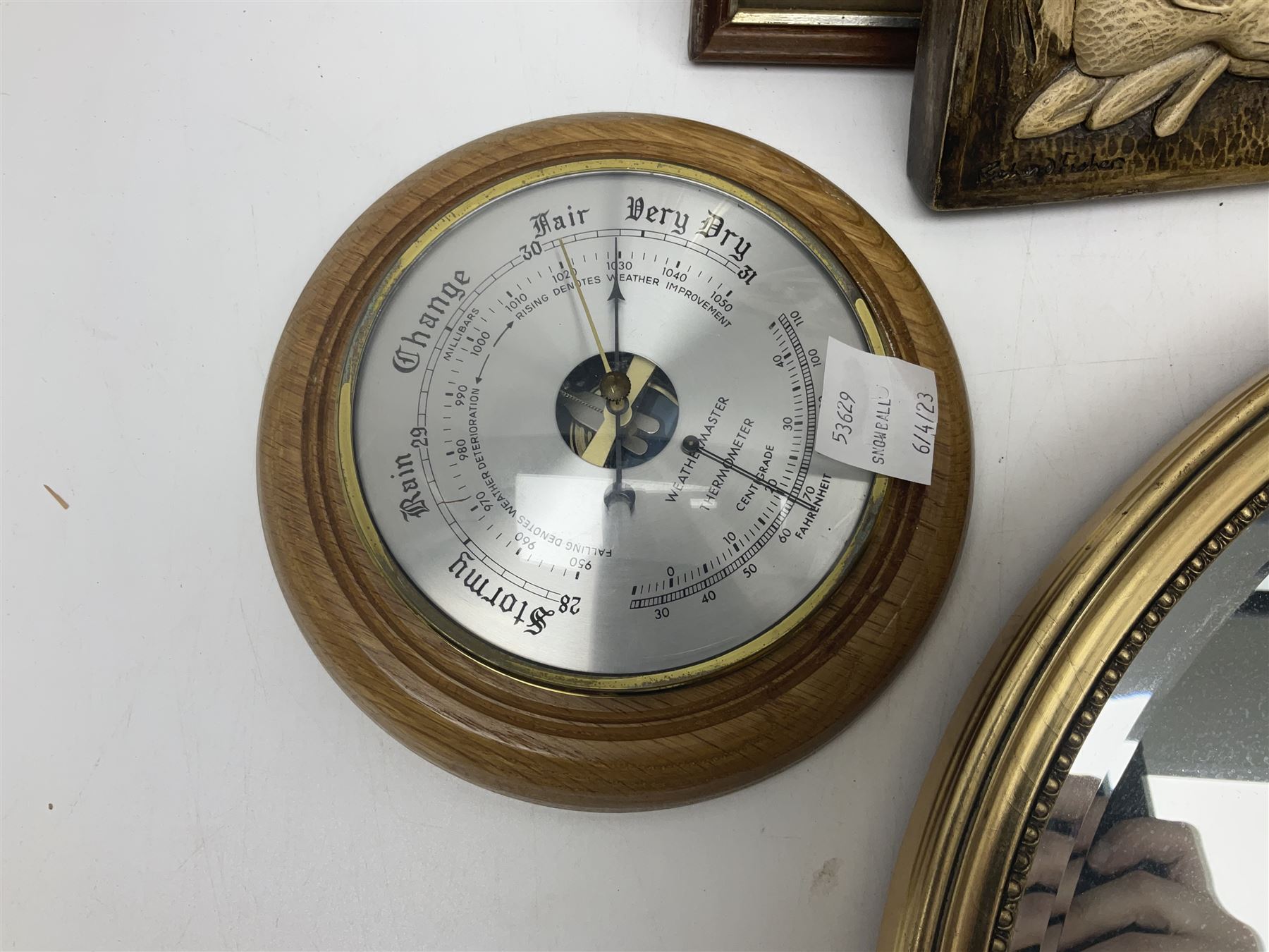 Two ceramic plaques by Richard Fisher, together with wooden plaques, artwork and three mirrors 