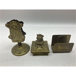 Collection of victorian and later brass desk accessories, to include a letter holder with cherub design, ink well of square form with hinged lid, brass table bell, brass casket with relief decoration, etc  