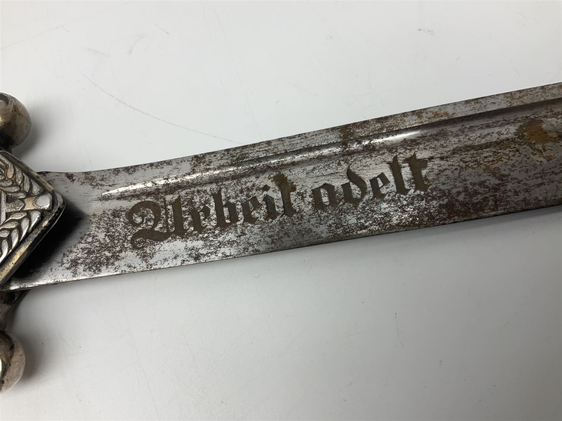 WW2 German RAD (Reichsarbeitdienst) Leader's hewer dagger,  the 25.5cm fullered steel blade engraved Arbeit Adelt (Work Enables) with Eickhorn squirrel maker's mark; scrolling cross-piece, mahogany grip and eagle pommel; in decorative plated scabbard L40cm overall.