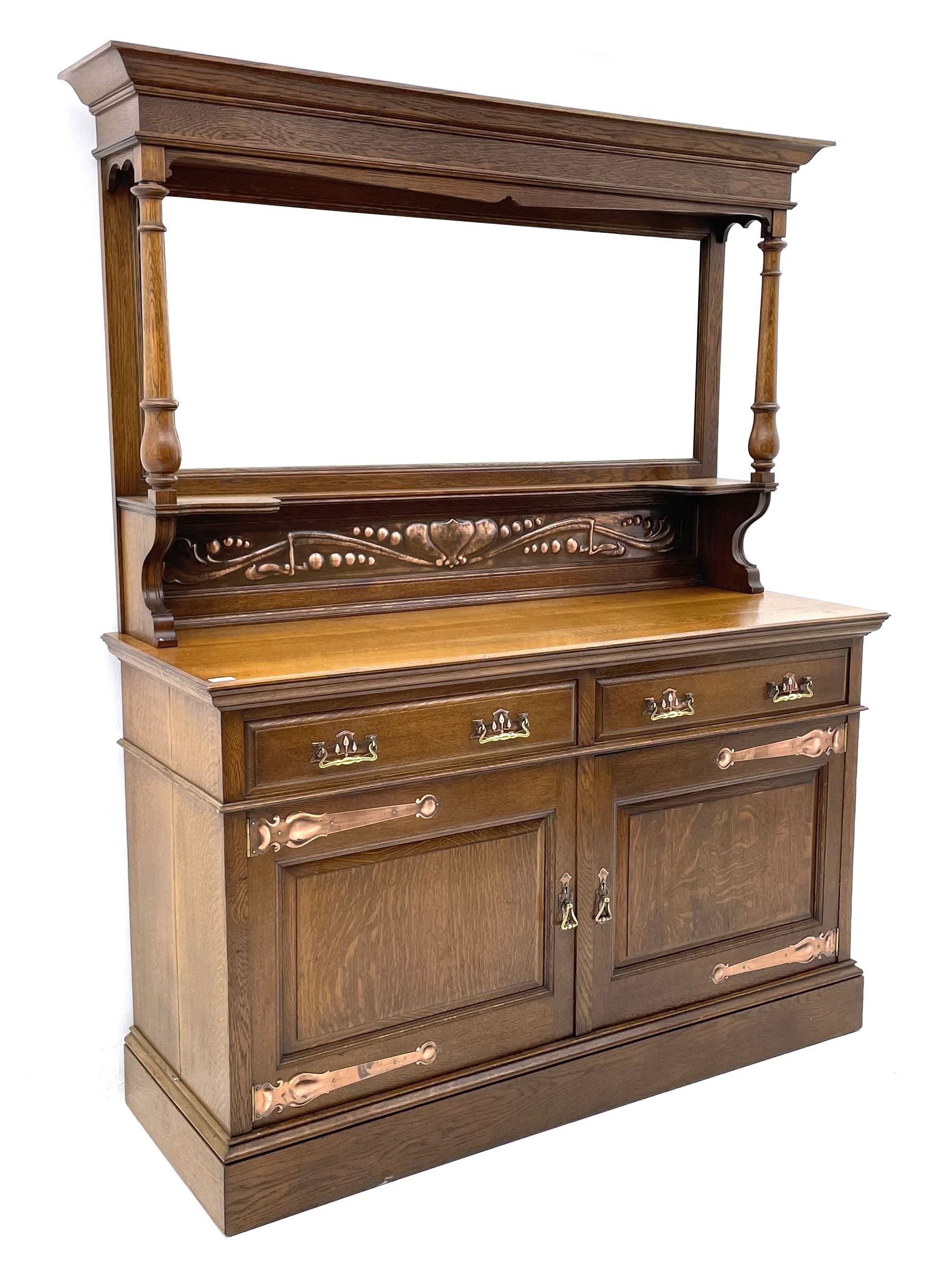 Arts and Crafts period oak mirror back dresser, projecting cornice above rectangular bevelled mirror and shelf, two turned supports, inset copper panel with embossed decoration, rectangular moulded top over two drawers and two panelled cupboard, moulded plinth base, brass and copper strappings and handles 