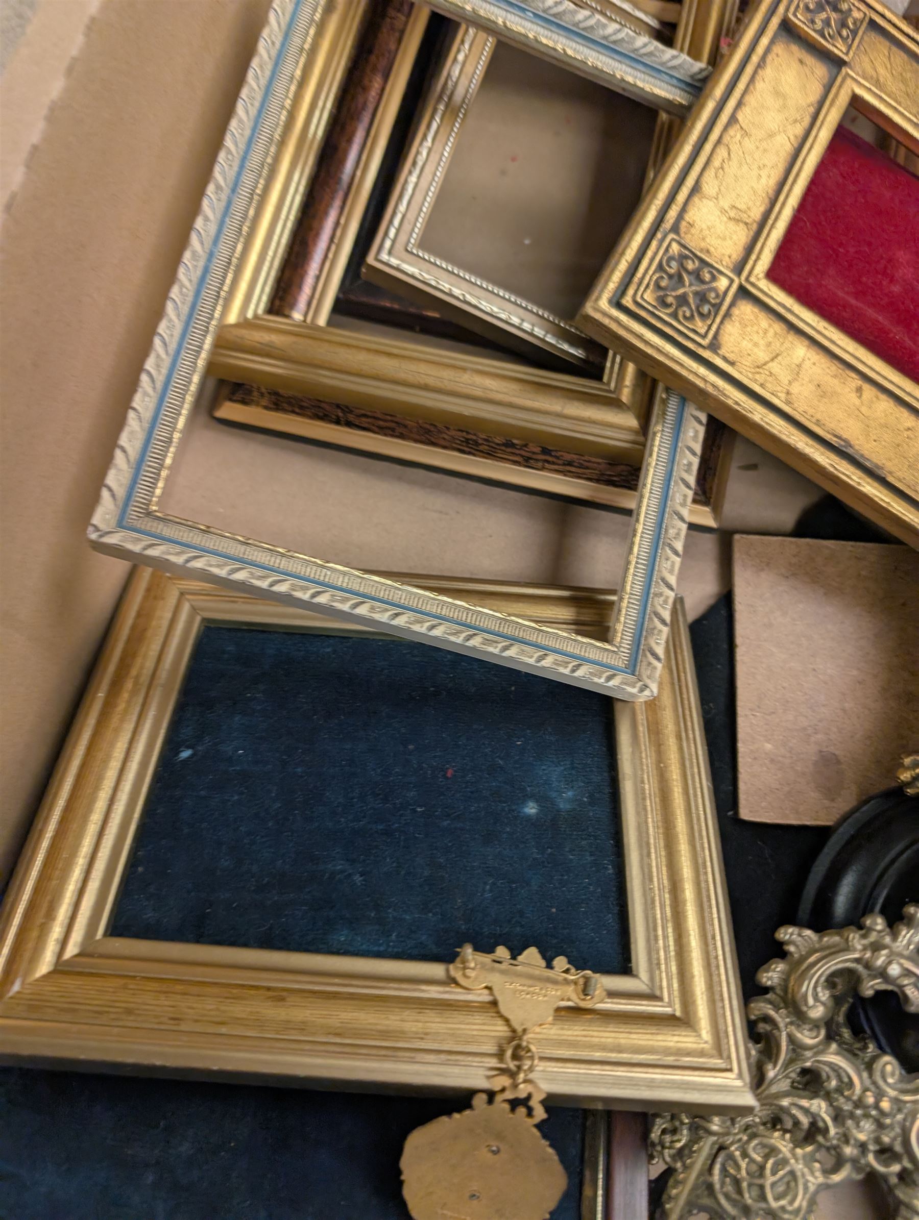 Brass easels, onyx box, frames, costume jewellery, pen nibs, etc, in two boxes