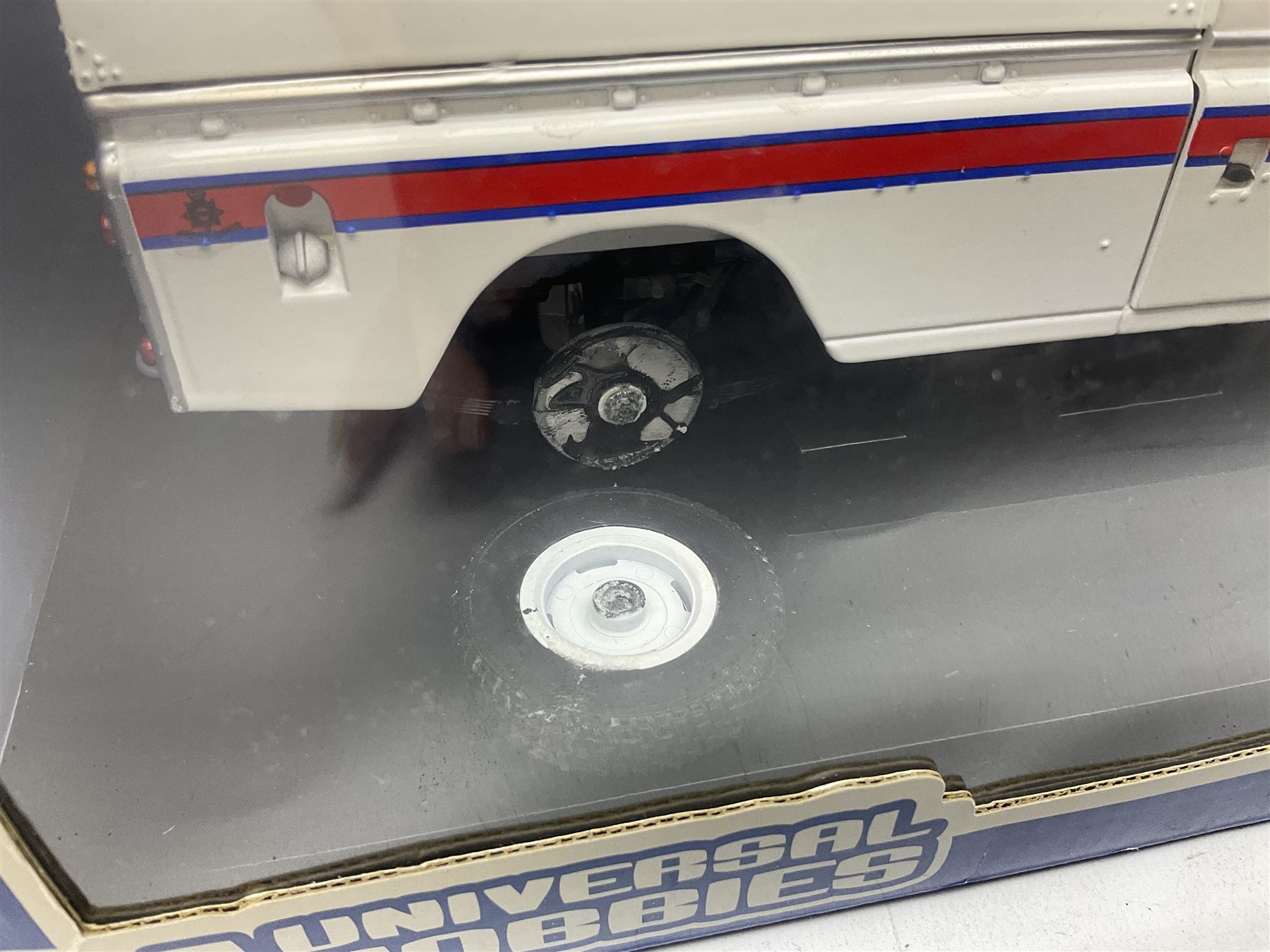 Six 1:18 scale die-cast models - Road Legends Chevrolet Nomad (1957) and Ford Fairlane Crown Victoria (1955); Universal Hobbies MGB-GT Mk.1 4-cylinder Old English White and Land Rover Serie III Police Patrol; Road Tough Shelby Cobra 427S/C (1964); and Mira 1955 Buick Century; all boxed (6)