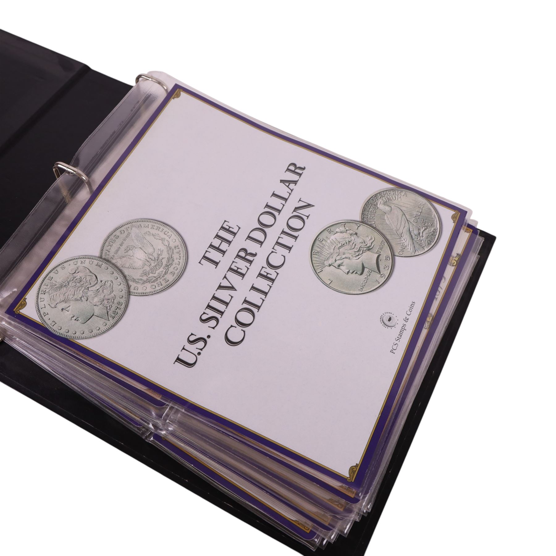 Twenty-five United States of America silver one dollar coins, comprising eighteen 'Morgan' and seven 'Peace' dollars, in 'The U.S. Silver Dollar Collection' ring binder
