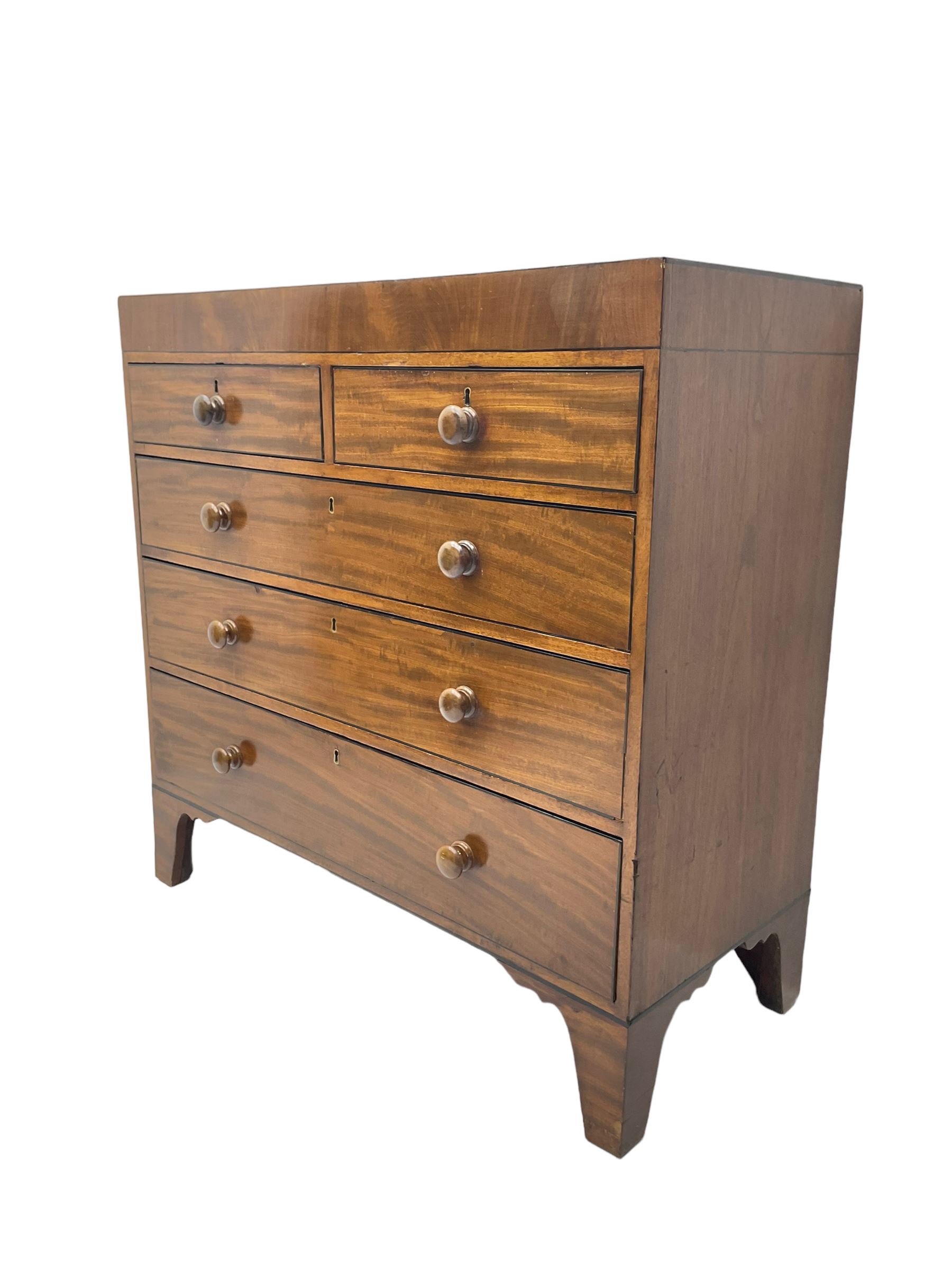 19th century straight-front chest, rectangular top with ebony strung edge, crossbanded frieze over two short and three long graduating drawers with ebony stringing, raised on bracket feet