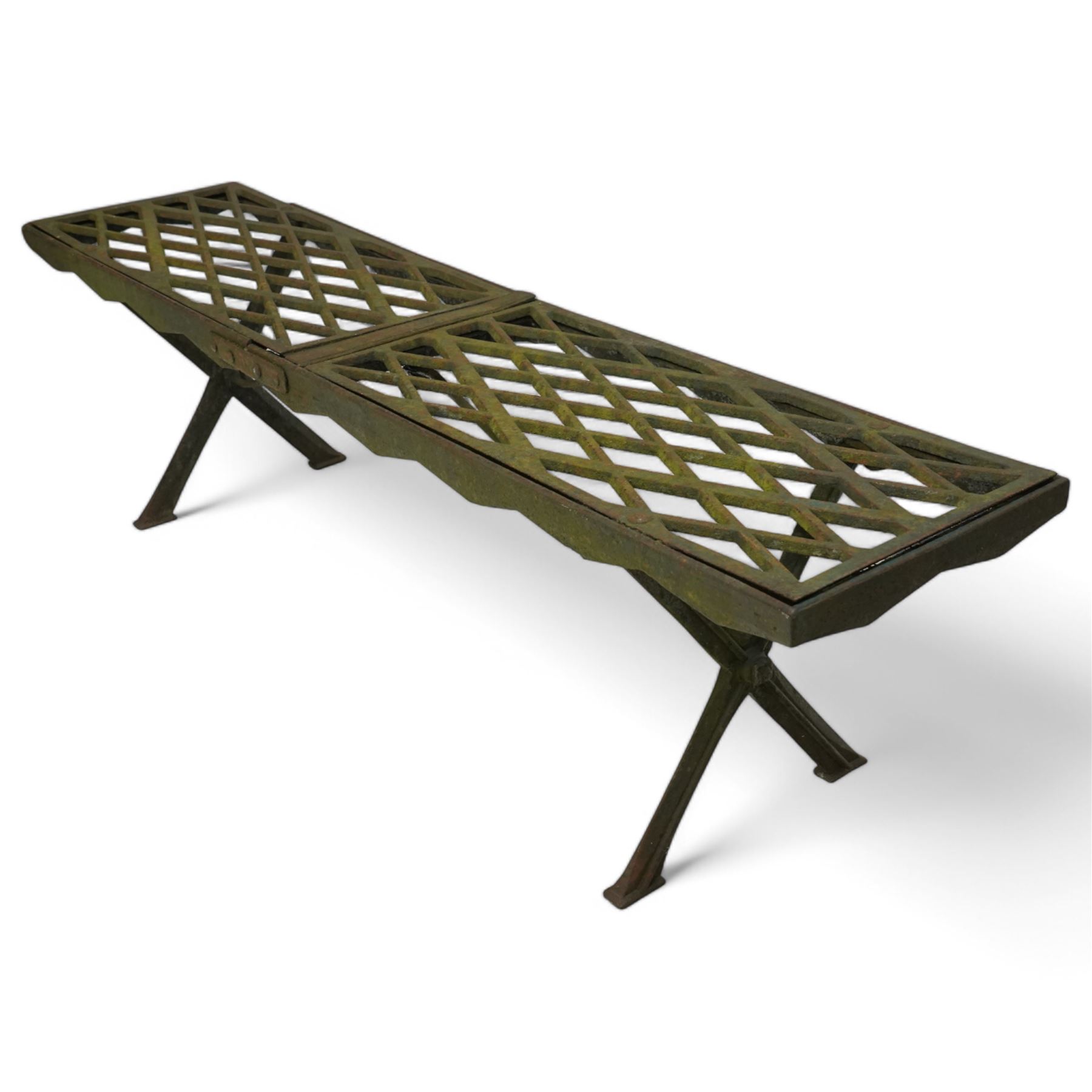 Two cast iron garden benches, rectangular seat with lozenge grate panels, on X-framed supports 
