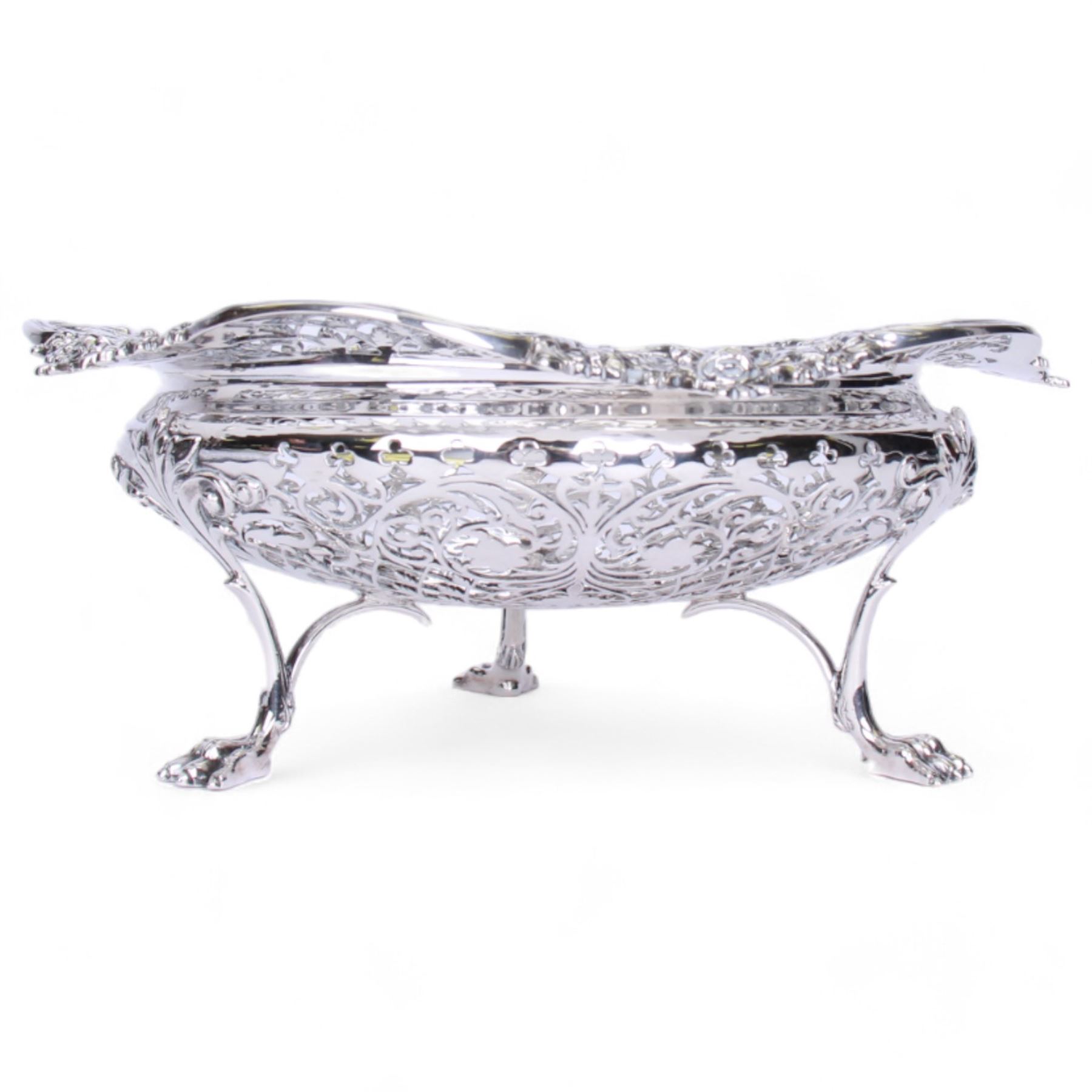 Early 20th century pierced silver bowl, of circular form with shaped rim with C scroll and foliate edge, the whole profusely pierced, upon three paw feet, hallmarked James Dixon & Sons Ltd, Sheffield 1916, H9cm D22.5cm