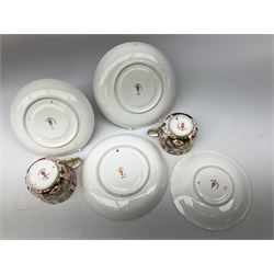 Royal Worcester blush ivory teacup and saucer, with painted floral decoration within gilt borders, date code mark for circa 1897, two Royal Crown Derby Imari pattern teacup trios, and another similar Derby cup and saucer, Shelley coffee cups and saucers, etc