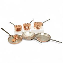 Suite of eight pieces of Mauviel French copper saucepans, frying pan, wok etc., retailed b...