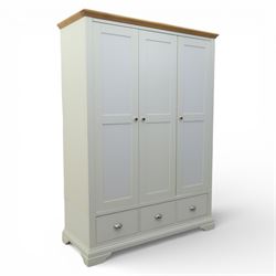 Modern triple wardrobe in white finish with oak moulded top enclosed by three doors with t...