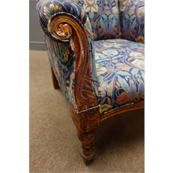  Victorian wingback armchair, upholstered in floral pattern fabric, scrolled arms and turned supports  