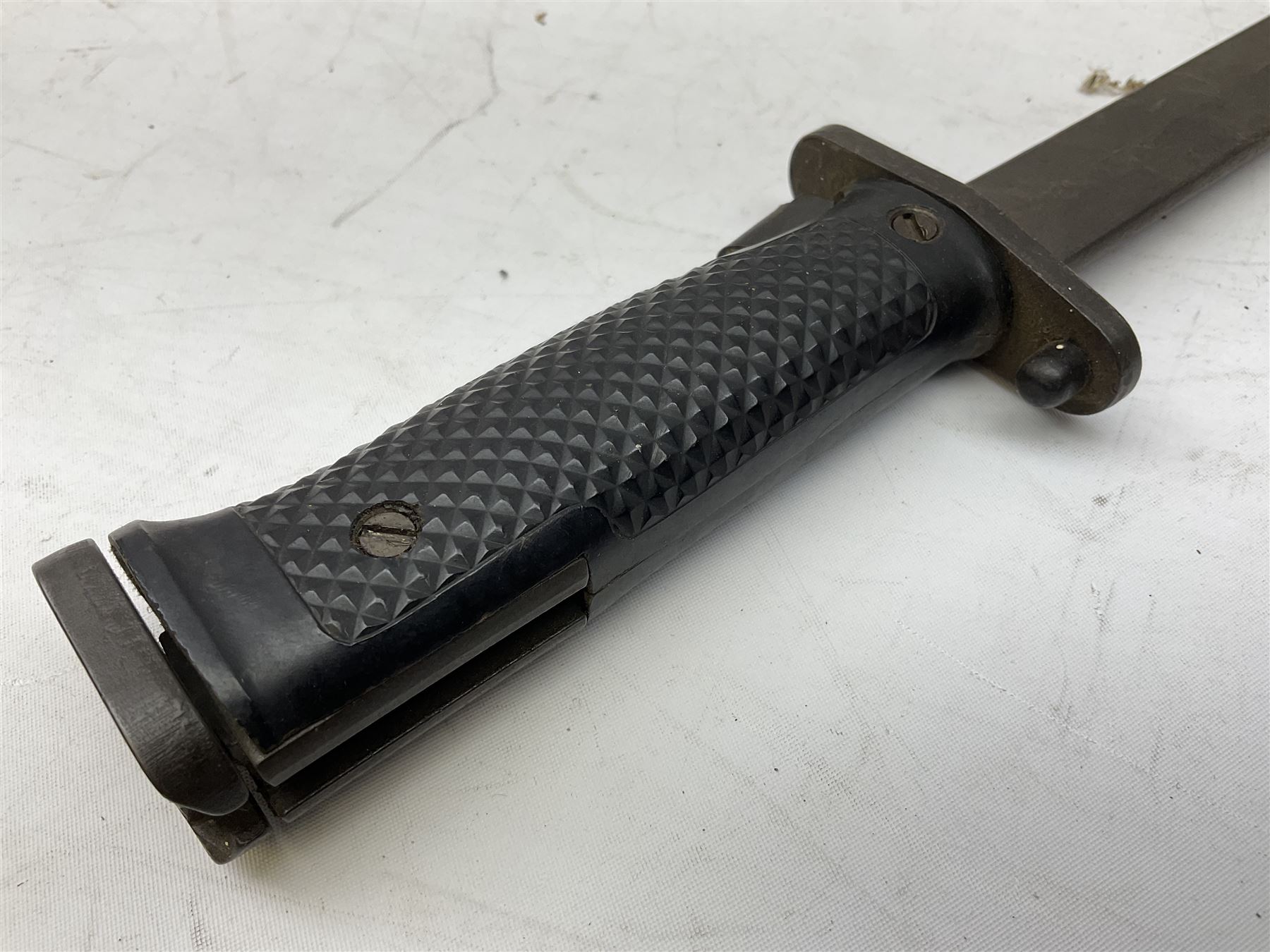 WW1 American Model 1917 Enfield bayonet by Remington with 43cm fullered steel blade; in leather scabbard with frog L59cm overall; and American M5A1 knife bayonet marked MILPAR COL to the cross-piece (no scabbard) (2)